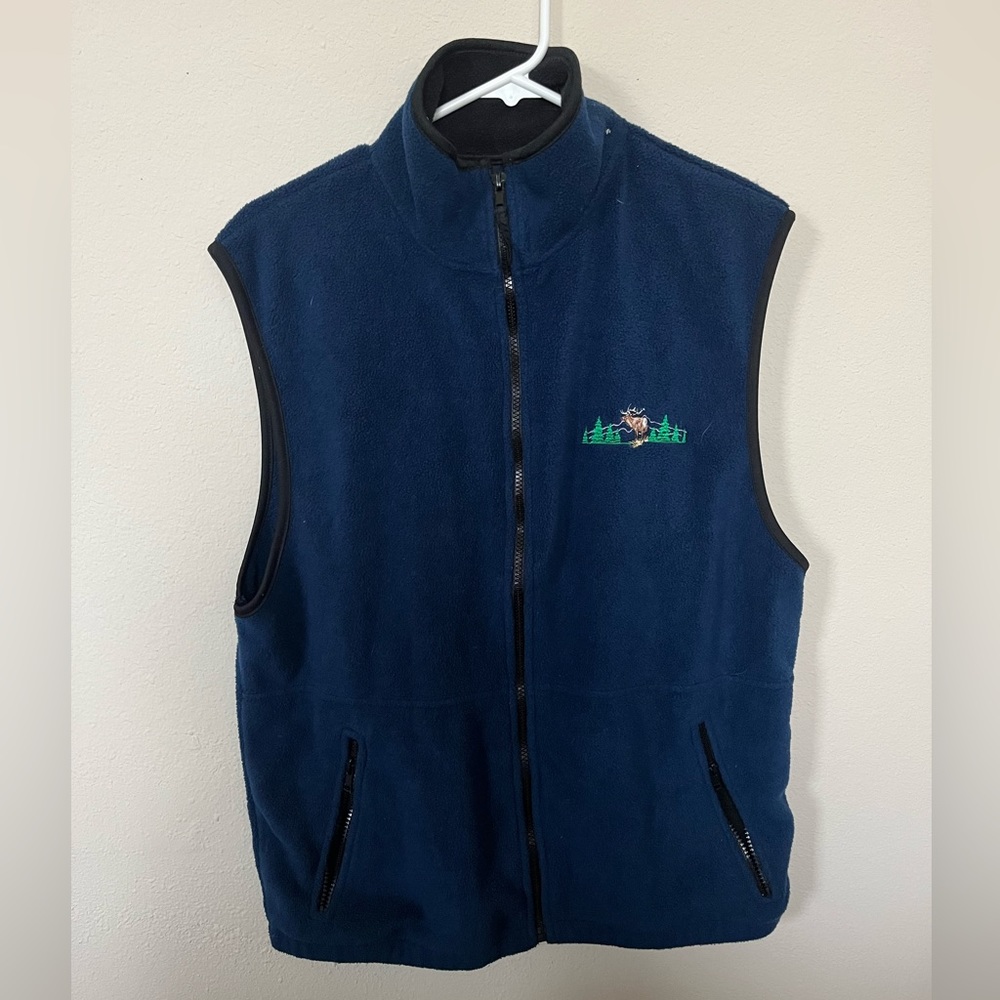 Brand: sportex. Warm vest with pockets. Dark blue zip up.